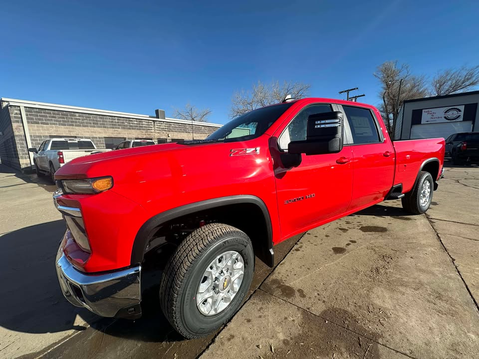 2026 Chevrolet Silverado 3500 HD LT in Red Hot — front three-quarter view