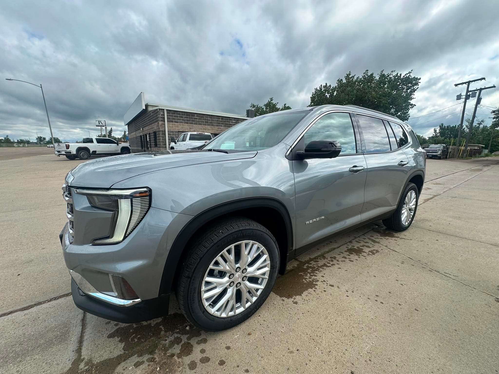 2026 GMC Acadia Elevation in Sterling Metallic — front three-quarter view