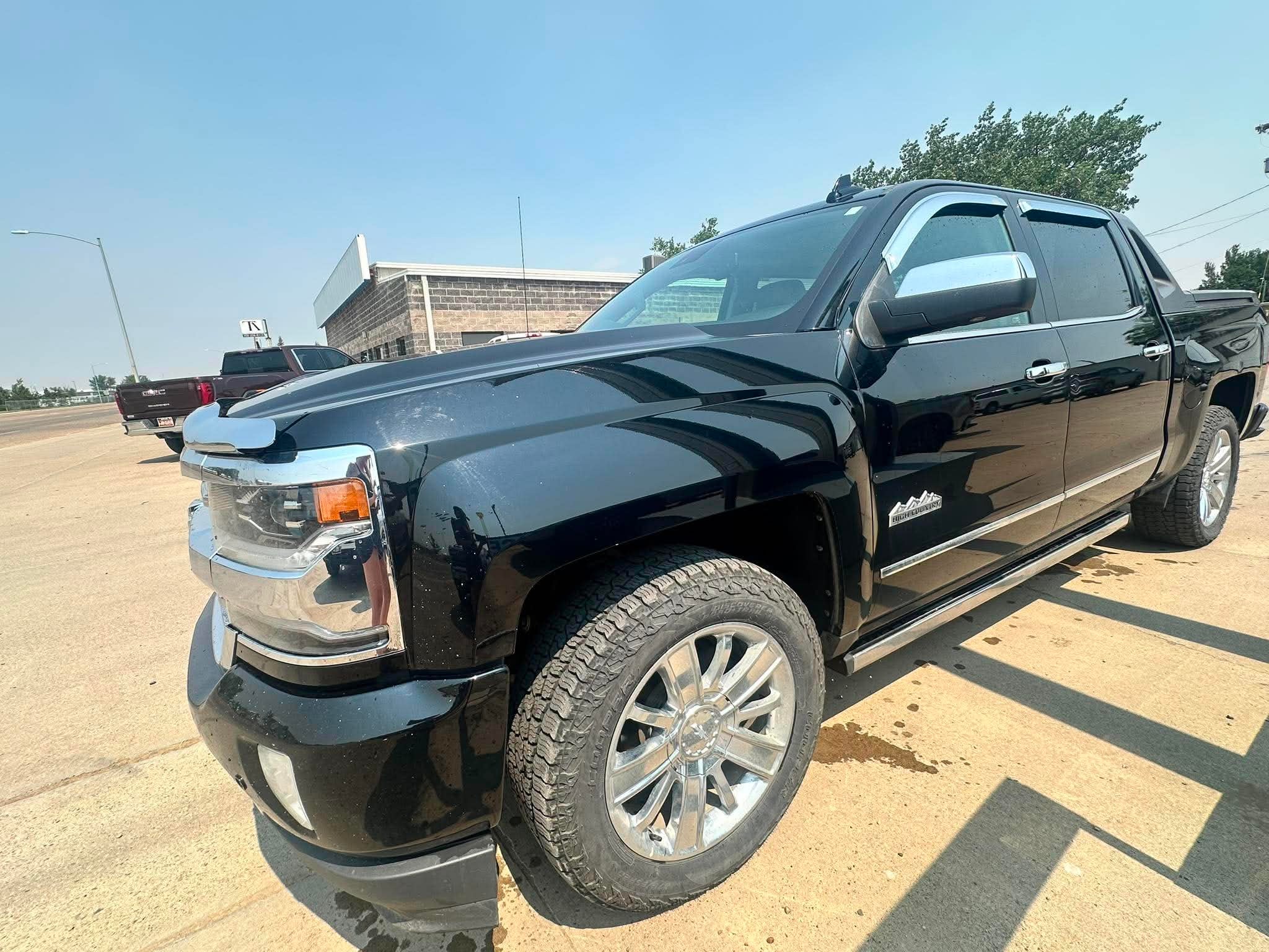 2018 Chevrolet Silverado 1500 High Country in Black — front three-quarter view