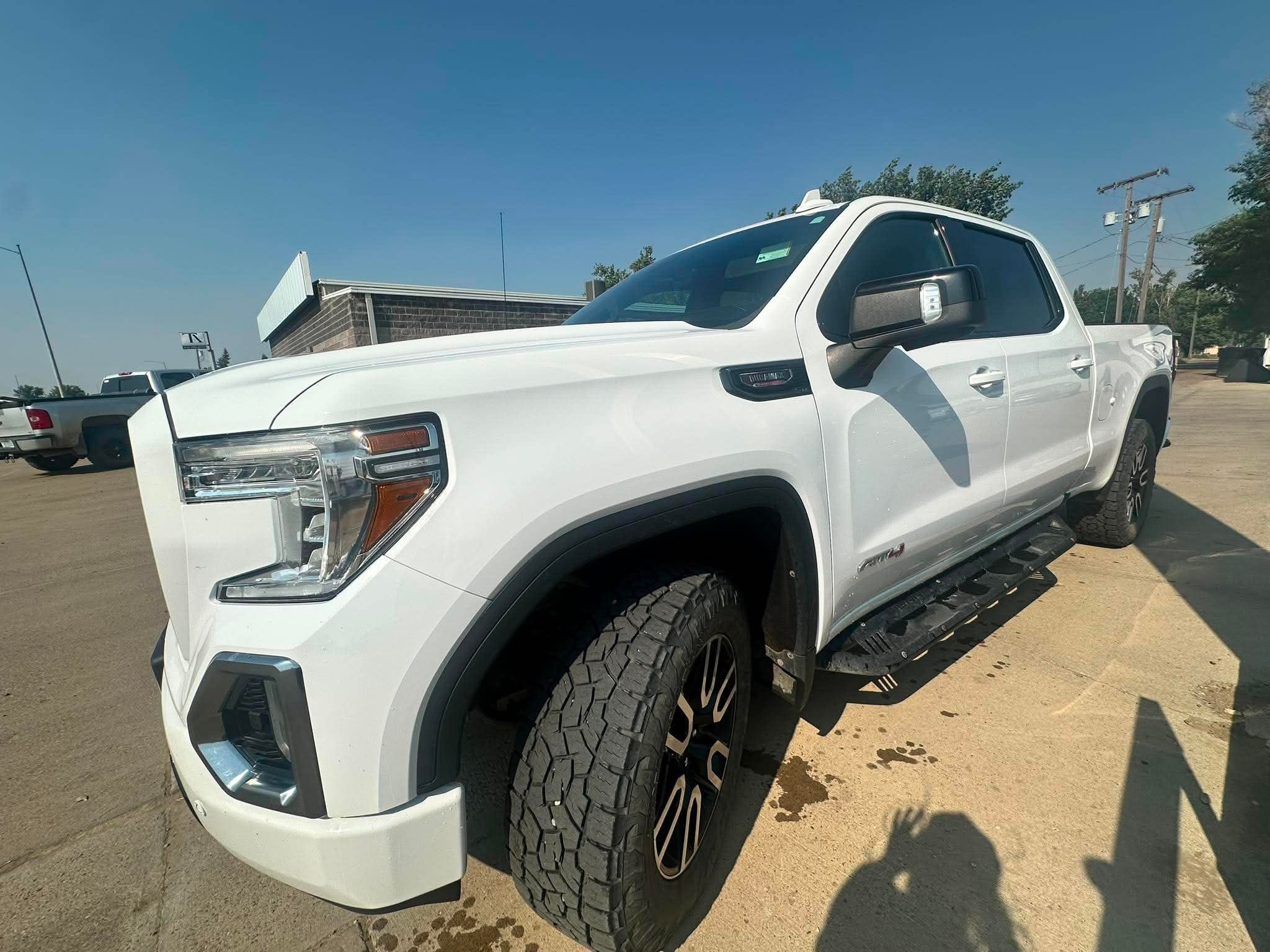 2021 GMC Sierra 1500 AT4 in Summit White — front three-quarter view