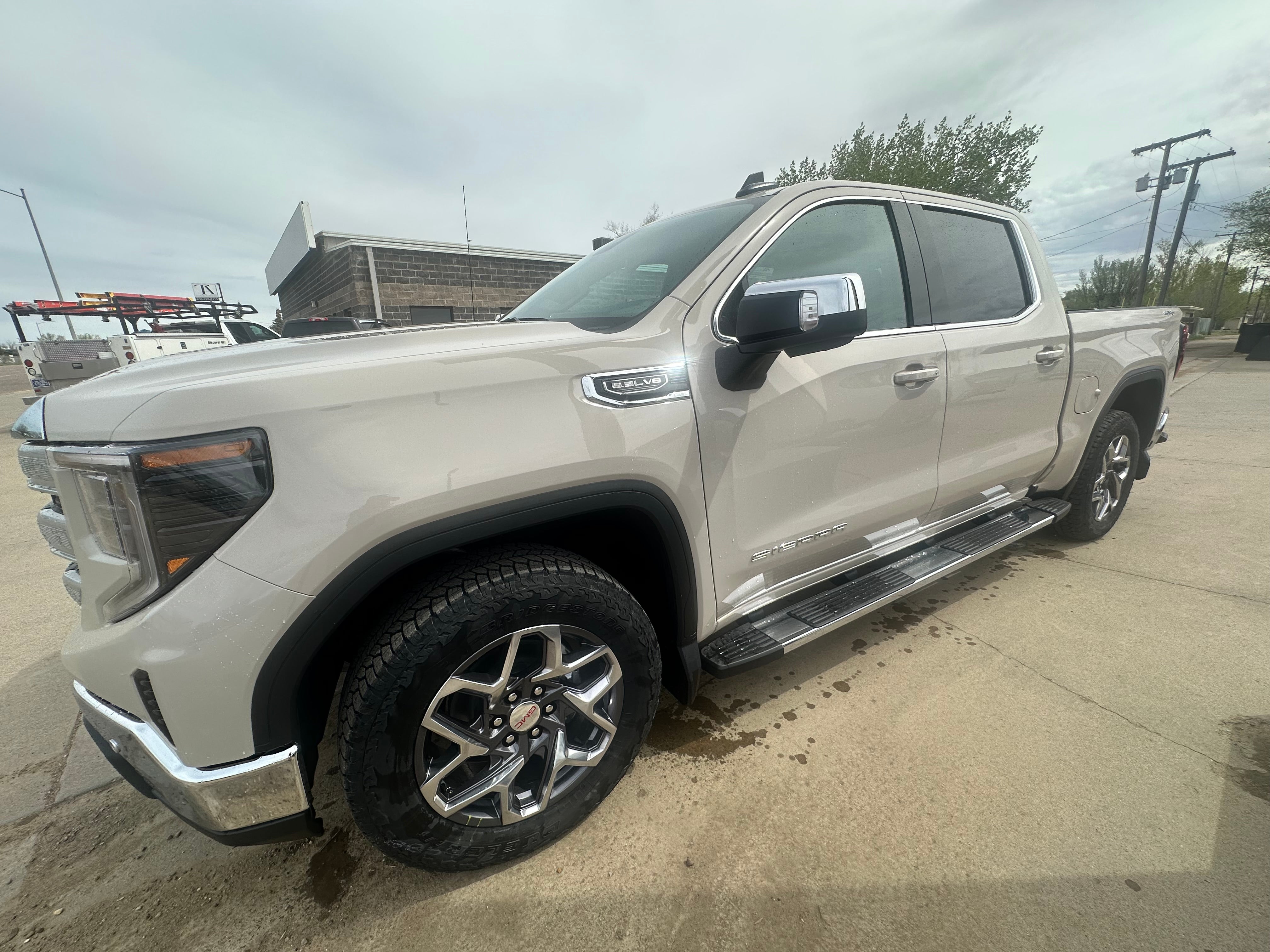 2026 GMC Sierra 1500 SLE in Coastal Dune — front three-quarter view