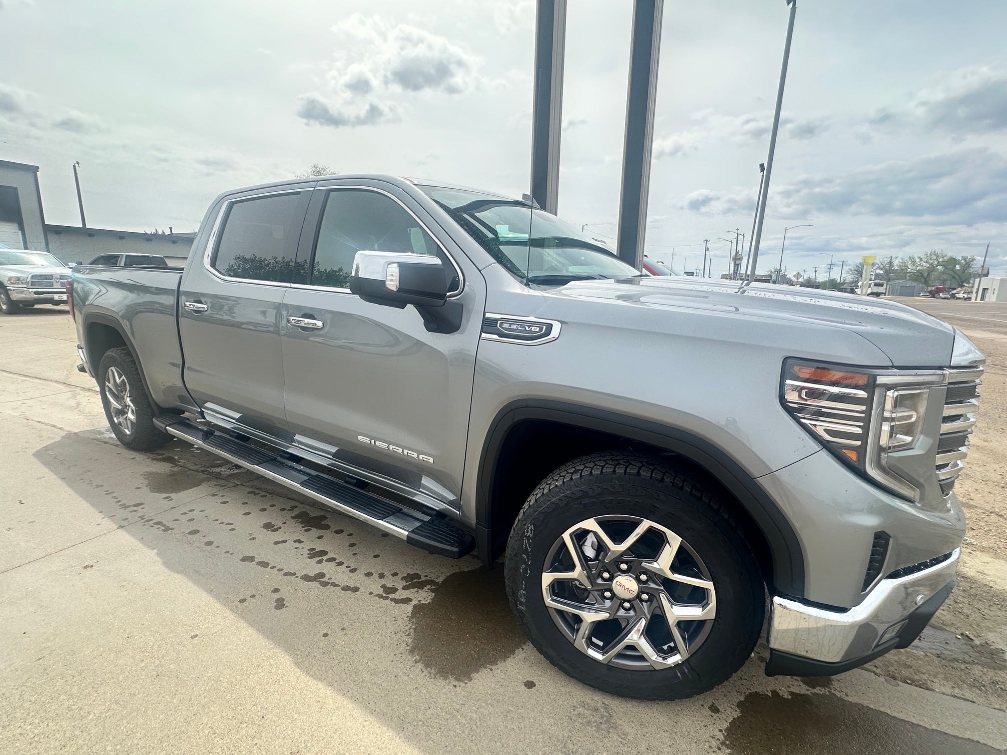 2026 GMC Sierra 1500 SLT in Sterling Metallic — front three-quarter view